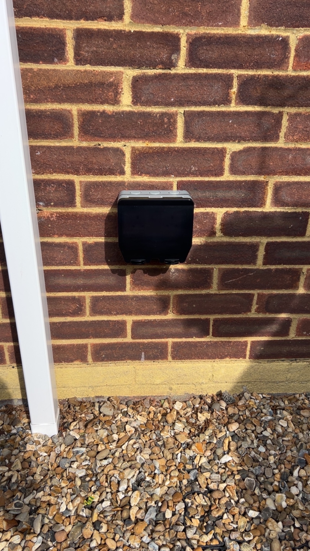 EV charger enclosure installed on exterior wall in Surrey